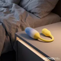 nexegg-vibrating-egg-double-silicone-layer-app-yellow-purple-in-344-01-clin-344-01.jpg